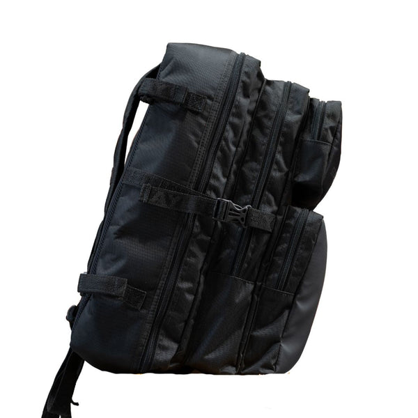 Mercian HOEL26BLK black hockey backpack side view with compression straps and multiple zip compartments
